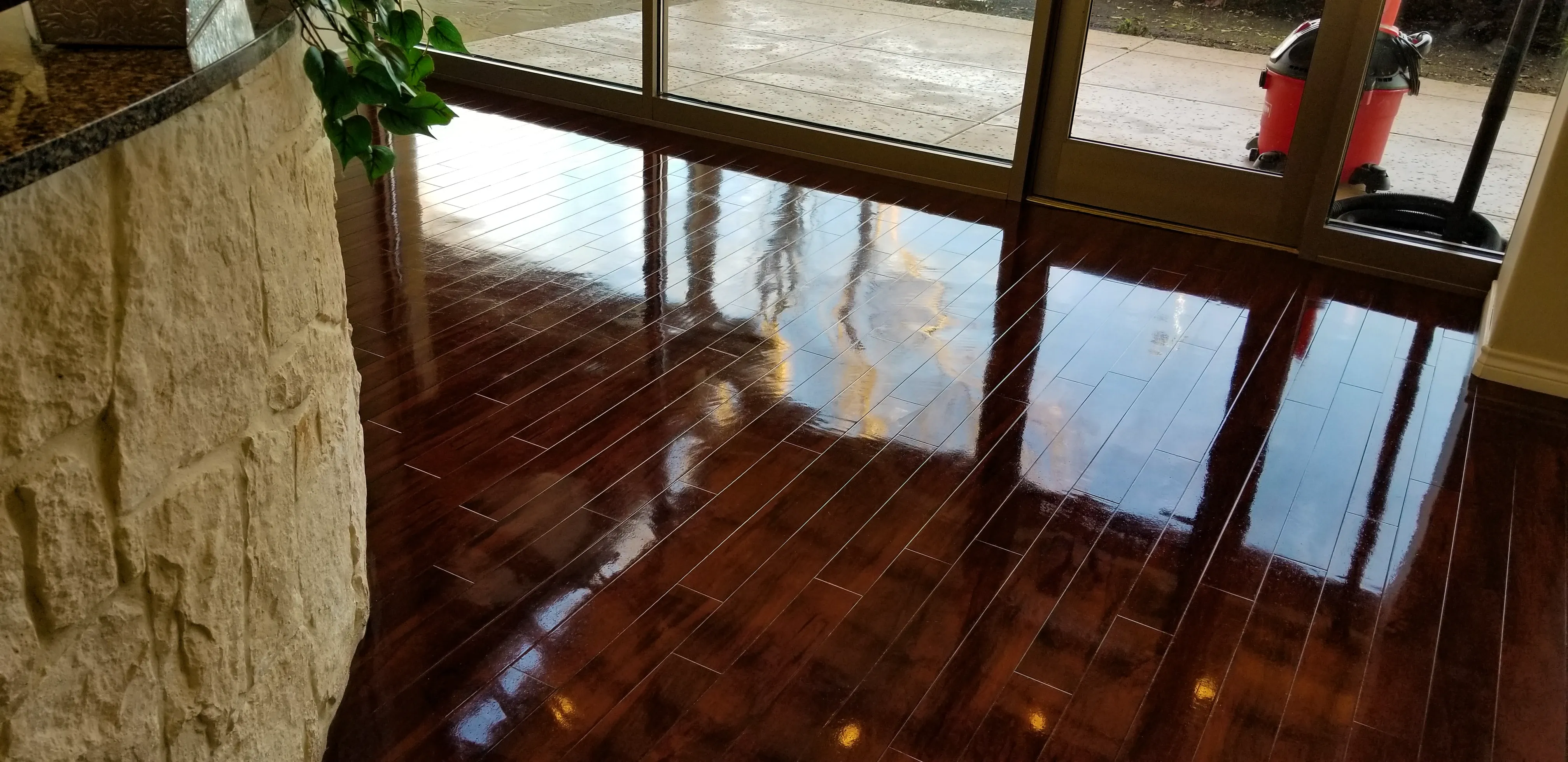 Detailed close-up of refinished hardwood plank flooring