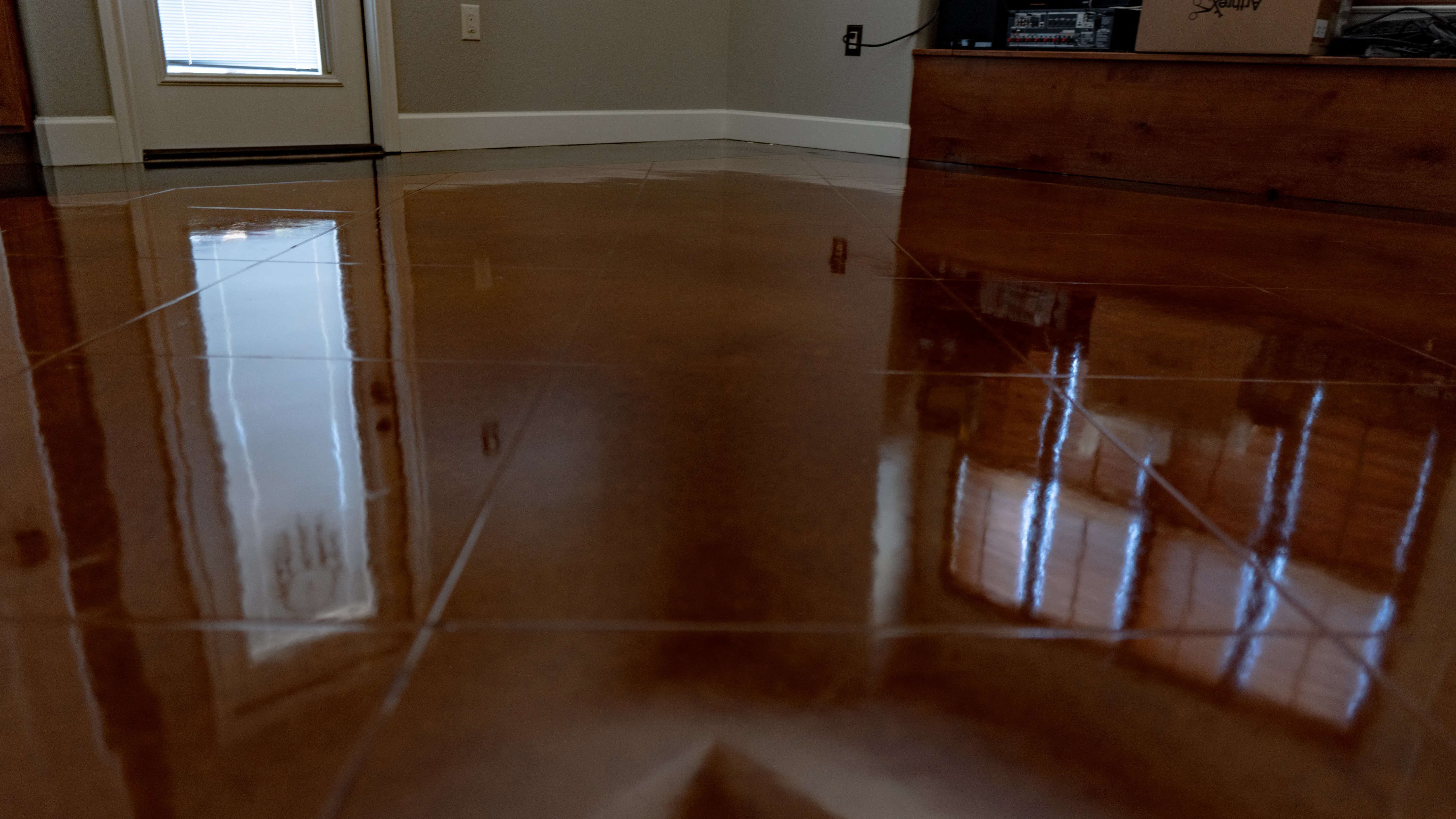 Decorative stained concrete with a high-gloss embossed surface