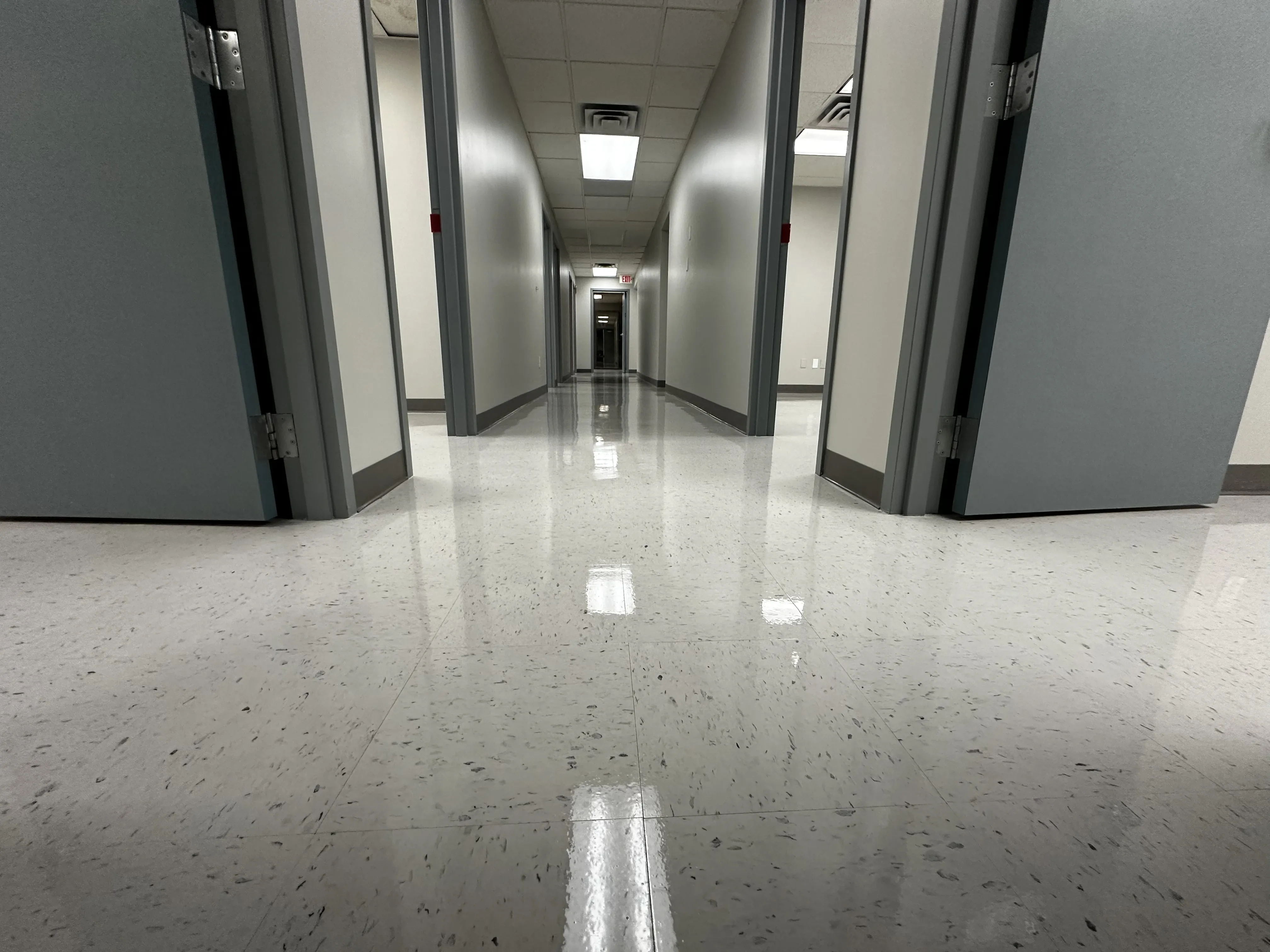 Hospital lobby VCT floor restored to a high-shine commercial finish