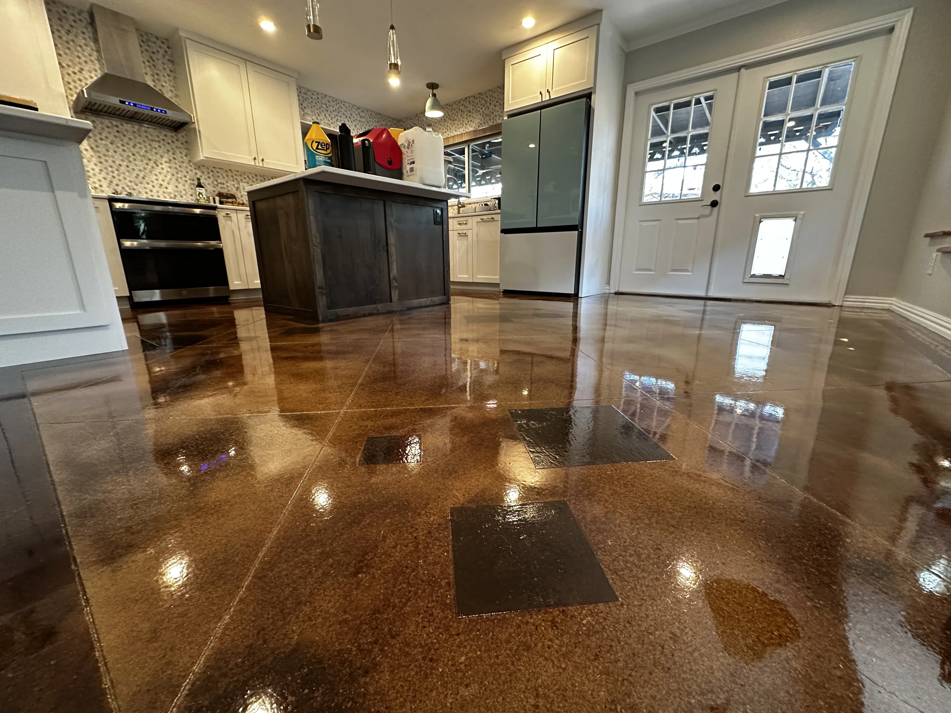 Custom-tinted stained concrete floor in a residential property in Converse